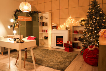 Interior of cozy living room with fireplace, table and Christmas tree decorated for holiday at night