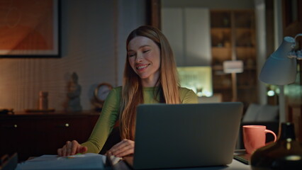 Satisfied startuper working late creating project on laptop closeup. Girl typing