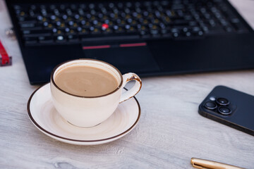 Elegant Coffee Break with Laptop and Smartphone on Wooden Desk