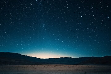Fototapeta premium A stunning long-exposure shot of the night sky over a desert landscape, showcasing the beauty of the cosmos, 