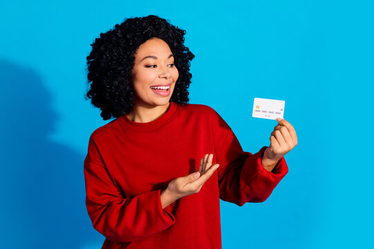 Photo portrait of lovely young lady point look credit card dressed stylish red garment isolated on blue color background