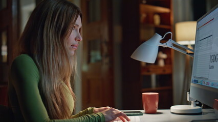 Woman programmer working night creating IT project on computer close up. 