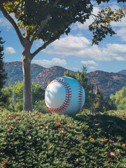 A concrete baseball for public sports park landscaping.