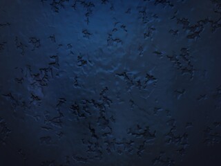 Fototapeta premium Close-up of a weathered blue and black textured wall surface.