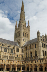 Spire Of The Norwich Cathedral England Great Britain On A Beautiful Summer Day With A Few Clouds In The Sky