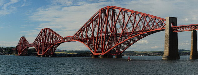 Red Steel Forth Bridge Edinburgh Scotland Great Britain On A Beautiful Summer Day With A Clear Blue Sky