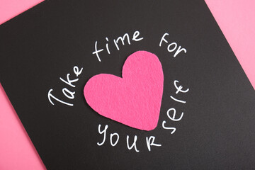 inscription take time for yourself, text in white chalk marker on black board, motivation for the day, top view, close-up self love concept,