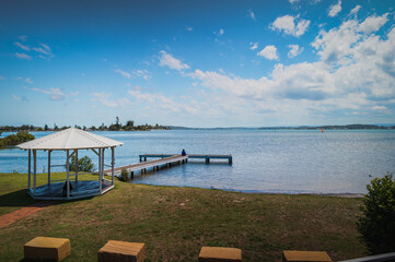 The photo shows a lakeside view located in Ken Lambkin Reserve