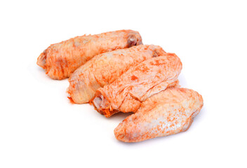 Raw chicken meat with bone on a white background