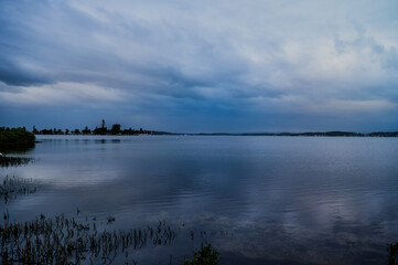 The photo shows a lakeside view located in Ken Lambkin Reserve