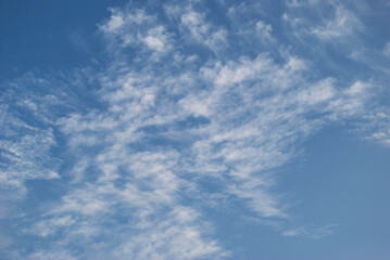 gentle white clouds in the blue sky