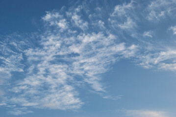 gentle white clouds in the blue sky