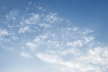 gentle white clouds in the blue sky