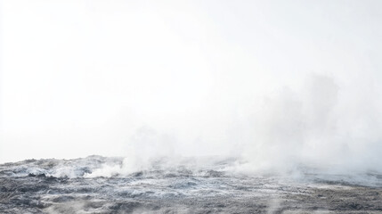 Fototapeta premium A serene landscape showcasing a misty volcanic area with billowing steam under a pale sky.
