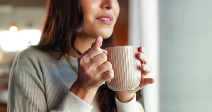 Thinking, window and coffee with hand of woman in living room for morning routine, vision and idea. Relax, peace and memory with person and tea cup at home for wake up, inspiration and reflection