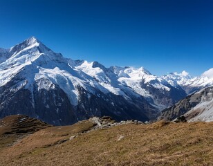 Fototapeta premium Snow-Capped Alps Under a Clear Blue Sky, Showcasing Europe's Majestic Mountains