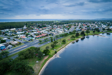 The photo shows a lakeside view located in Ken Lambkin Reserve