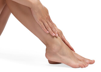 Woman touching her smooth feet on white background, closeup