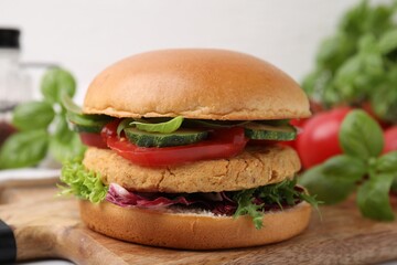 Delicious vegan burger with chickpea cutlet on table, closeup