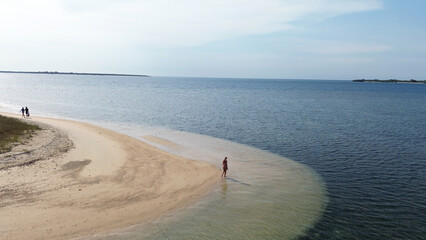 Small island Pulau Bedil, tropical island in Indonesia. Drone view.