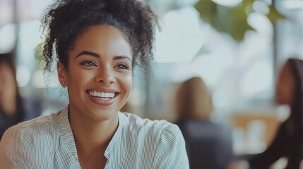 Joyful woman smiling in a casual cafe setting