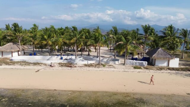 Small island Pulau Bedil, tropical island in Indonesia. Drone view.