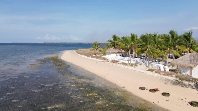 Small island Pulau Bedil, tropical island in Indonesia. Drone view.