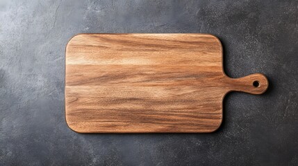 A rustic wooden cutting board rests on a dark surface, showcasing its unique grain and craftsmanship.