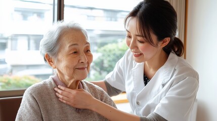 Fototapeta premium 日本の思いやりある介護：高齢女性を支援する若い介護者