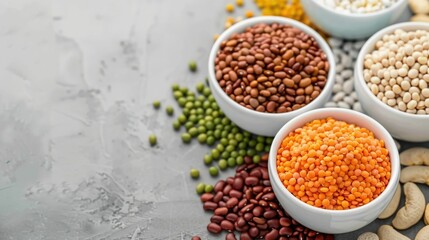 Assorted variety of beans legumes and pulses arranged in bowls with health and nutrition icons on a bright white background  Concept of plant based protein fiber