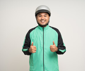 Young asian rider wearing green jacket uniform and helmet standing various action on isolated white background. Male delivery service worker. Delivery courier and shipping food service.