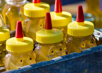 Crate of fresh honey for sale at a farmers market