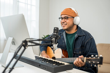 Professional Musician with condenser microphone and tablet for Mixing Mastering music. Music...