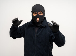 Thief in uniform black jacket various pose on isolated background. The Robber terrorism criminal escapes with balaclava and crowbar entering a house for stealing Housebreak