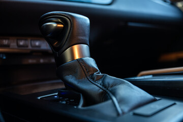  Close up of the manual gearbox transmission handle. Accelerator handle and buttons in a new car.