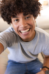 Obraz premium On video call, Smiling young man, enjoying moment, at home
