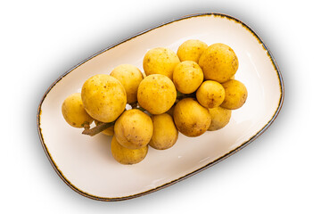 High angle view bunch of Long Kong, Longkong, Langsart in brown ceramic tray isolated on white background with clipping path.