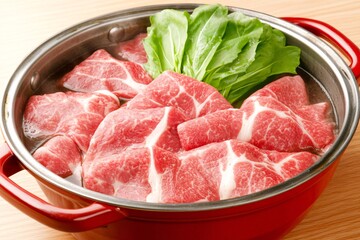 Fresh Slices of Meat and Lettuce in Hot Pot