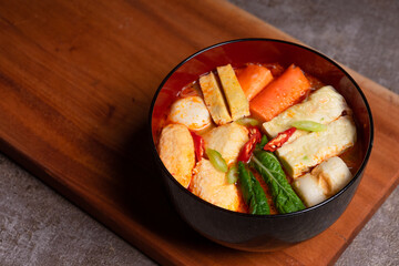 Steamboat is a soupy dish with fillings such as vegetables, seafood, eggs, meat, and noodles. a...
