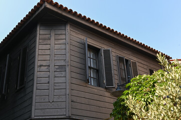 The second floor of an old building is paneled with dark wood