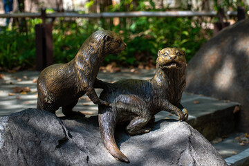 sea otter statue in a zoo 