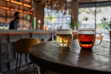 Drink tea at home on sunset. Energy tonic with turmeric, ginger, and lemon. relaxation, home time, sweet home, and break tea time at home.