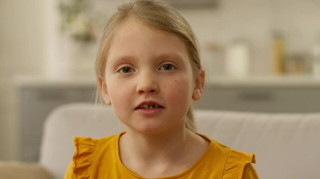 Angry little European girl child kid daughter offspring aggressive childish scream shouting yelling quarrel conflict naughty preteen noise headshot overwhelmed crazy emotional expression furious mad