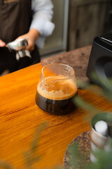 making a big shot of espresso at the coffee shop. a cup of espresso coffee