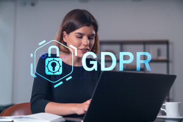 Woman working on laptop with GDPR lock icon overlay in office.