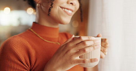 Coffee, hands and wellness with smile of woman in living room of apartment to relax on weekend....