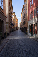 Stockholm, Sweden - 22nd of July 2023. Colourful houses along a street in Gamla Stan, the old town of Stockholm, Sweden.