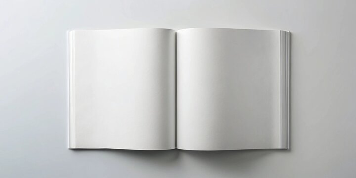 Open blank book on white background with shadows creating a minimalistic and clean visual
