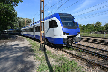 Fototapeta premium Polish electric multiple unit passenger train in a siding near Krakow station. 