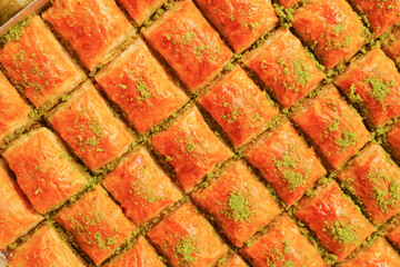 Enjoy the mouthwatering and delicious Baklava Slices that come with a delightful Pistachio Topping